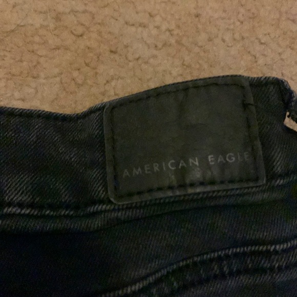 Black stretchy American Eagle jeans with a cross over waist - Picture 3 of 6